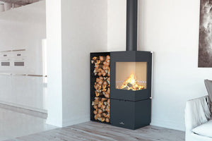 Bronpi - Bombay E - 7kW Freestanding Wood Stove with flames next to a log storage