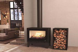 Bronpi - Cairo 70 - 14kW Freestanding Wood Burning Box Stove with flames on an entryway next to log storage