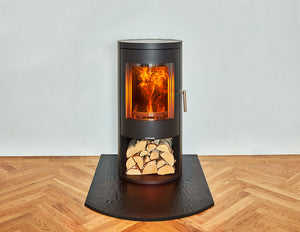 Opus Melody with Log Storage on a black hearth on a wooden floor